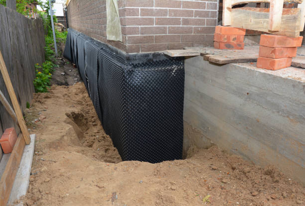 SJ Waterproofing Pros technician performing targeted Sump Pump Installation assessment in Leonard, MI